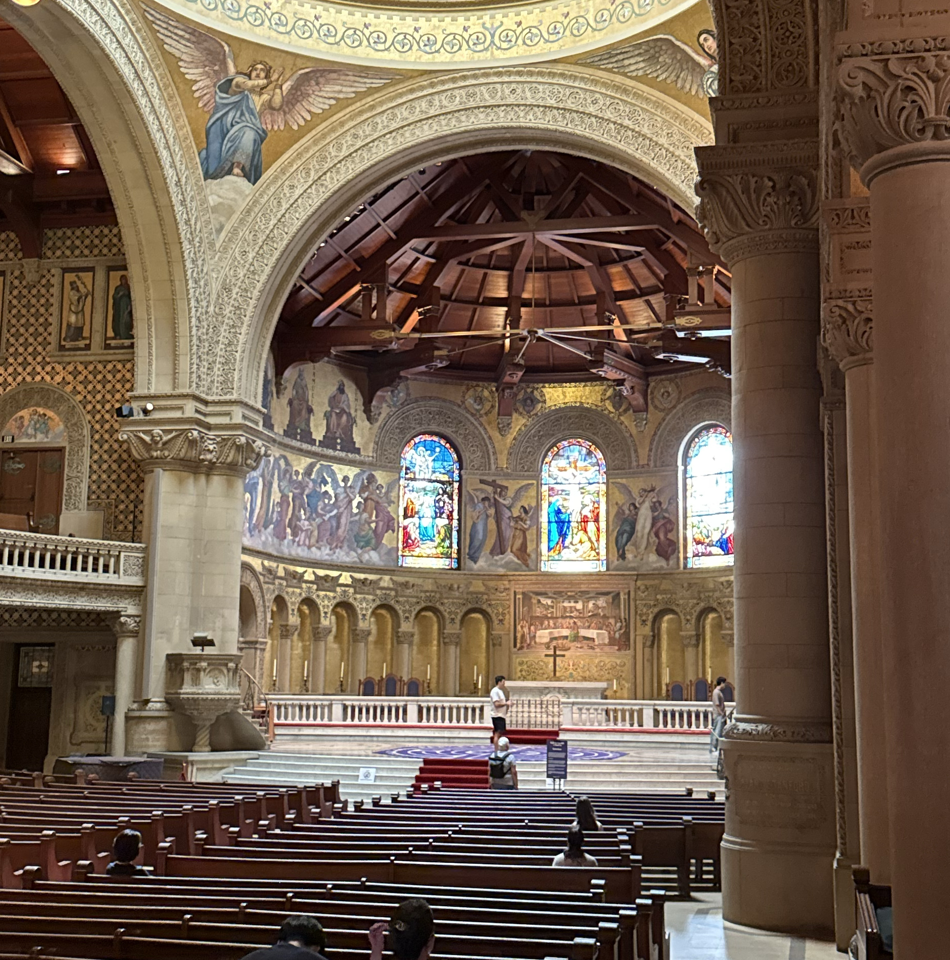 Interior of Stanford Memorial Church with mosaics, stained glass, and wooden ceiling