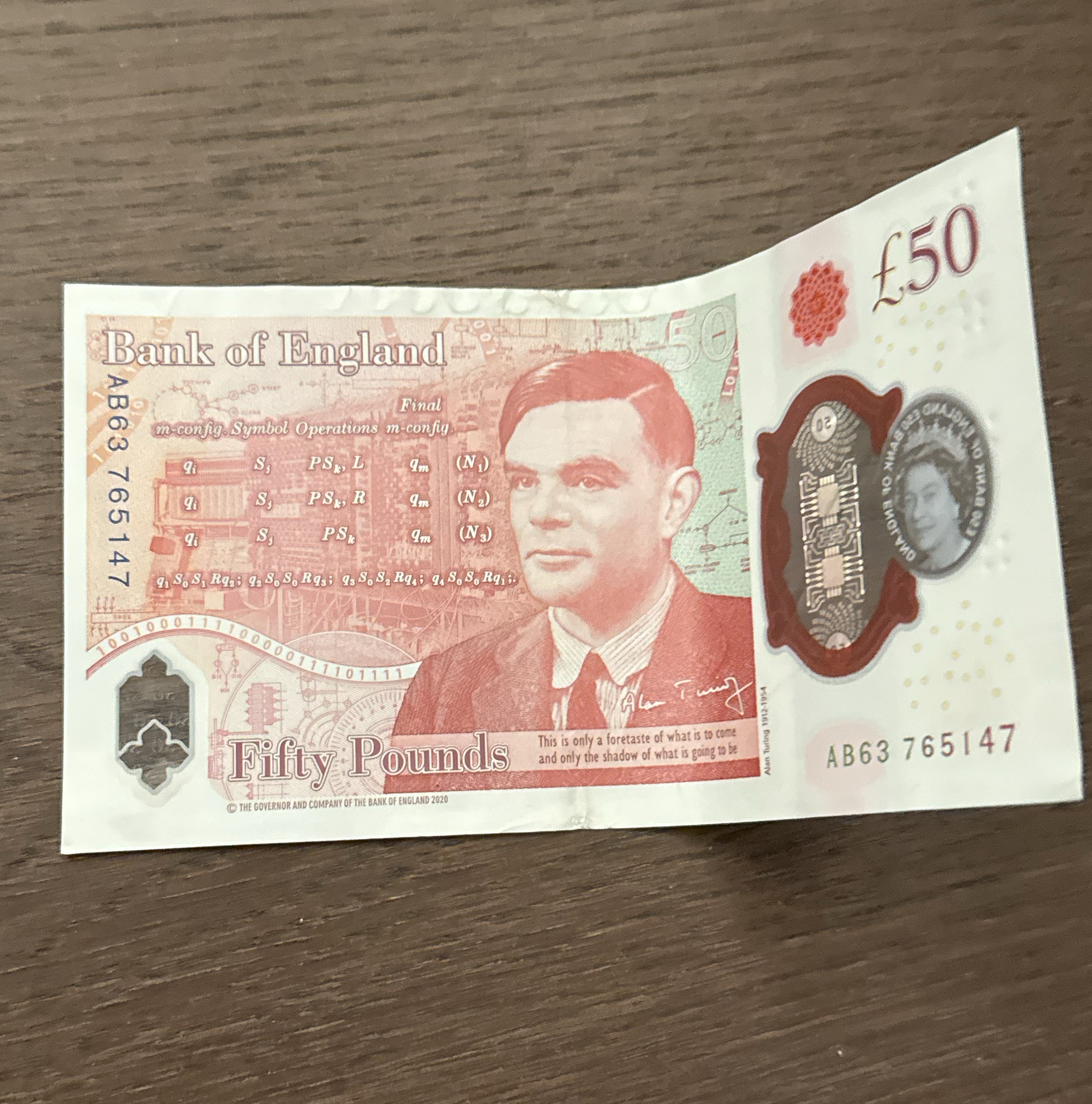 £50 banknote on a wooden table